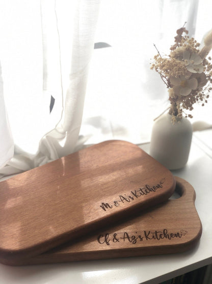 Engraved serving board made from ebony wood with personalized name perfect as wedding gift or housewarming gift